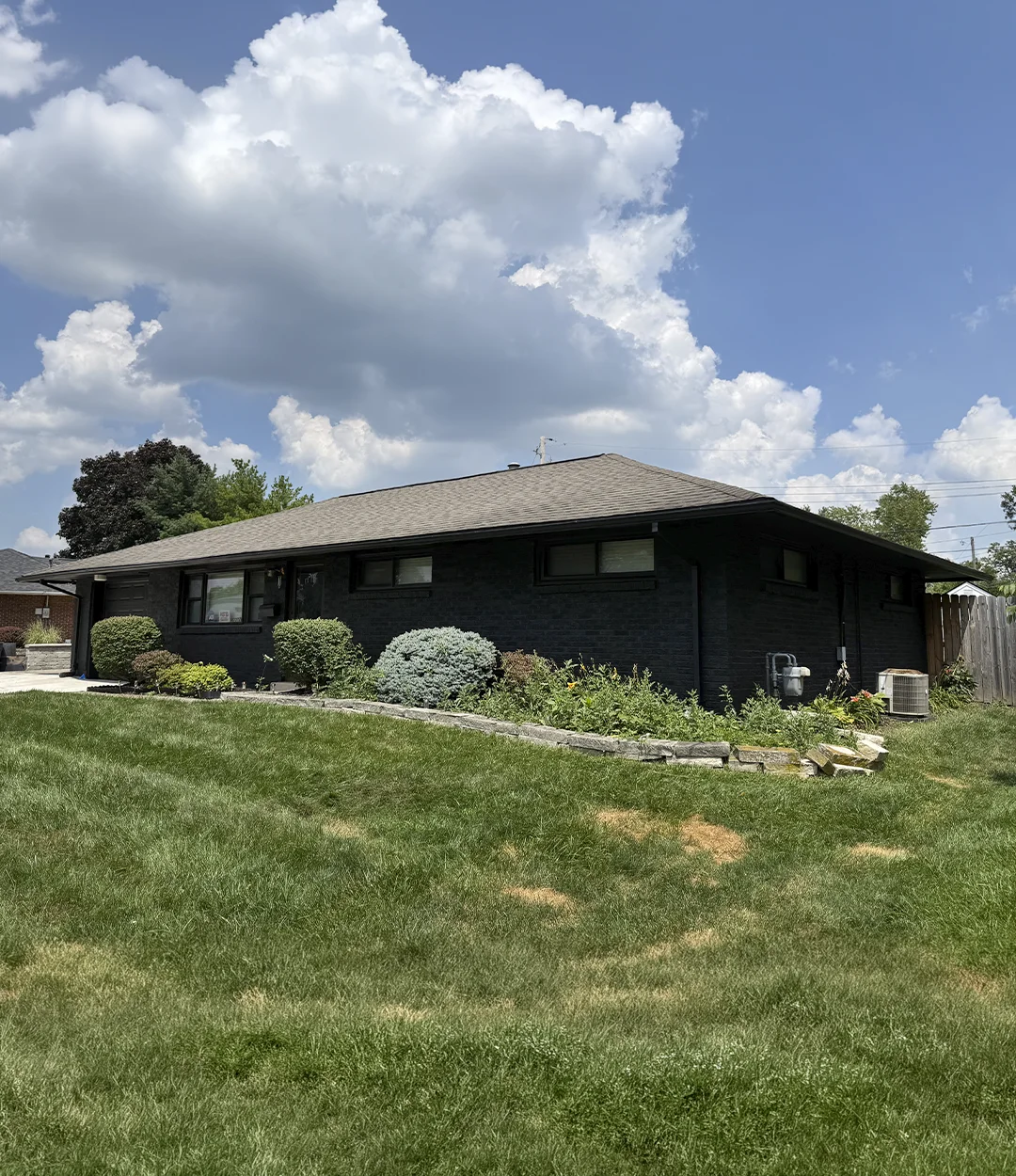 Brick home repainted black